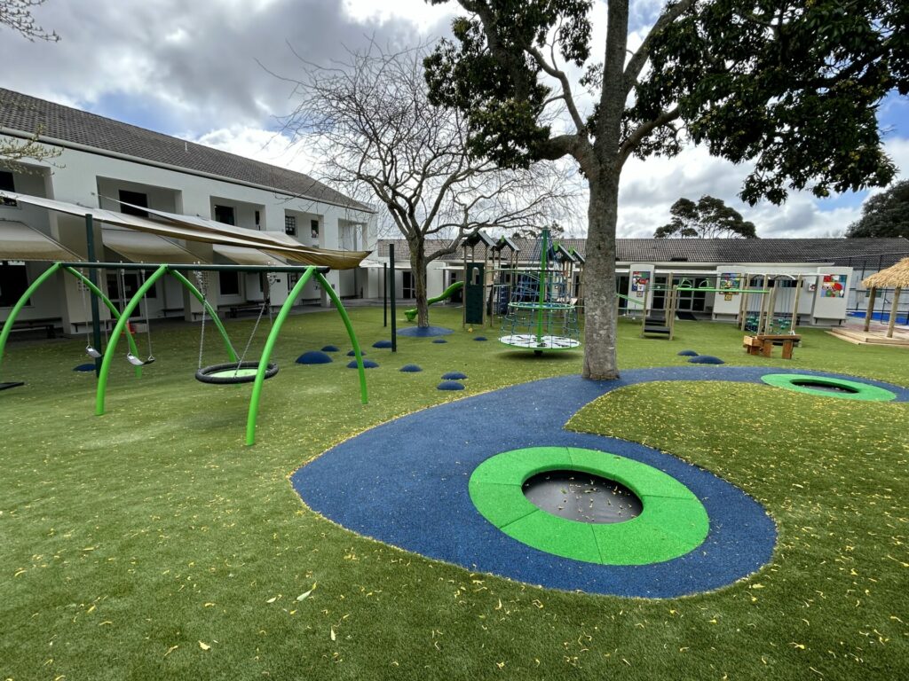 The playground design incorporated different areas and activities to engage all ages, including an Orex Spinner and a Fale stage for performance play.