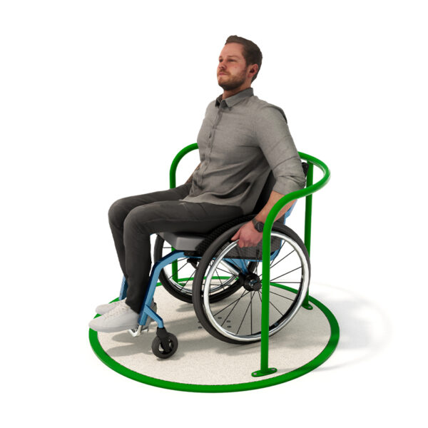 View of the Wheelchair Mini Carousel in use from Park Supplies & Playgrounds in New Zealand, featuring a textured base, a single handrail, and a central rotating mechanism.
